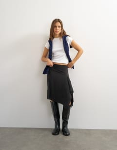 Model wearing Asymmetric cupro soft midi skirt in black