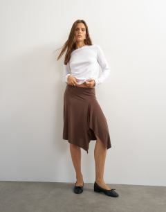 Model wearing Asymmetric cupro soft midi skirt in chocolate