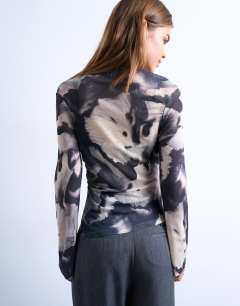 Model wearing Asymmetric drape abstract print top in multi
