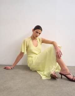 Model wearing Asymmetric flutter sleeve maxi dress with seaming in lemon