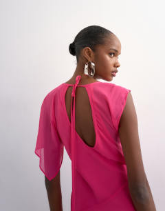 Model wearing Asymmetric flutter sleeve maxi dress with seaming in pink