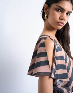 Model wearing Asymmetric frill mini dress in abstract choc stripe