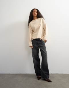 Model wearing Asymmetric hem raglan sleeve skater t-shirt in ecru