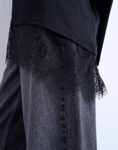 Model wearing Asymmetric lace trim oversized skater tee in black