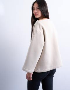 Model wearing Asymmetric off shoulder sweat in beige