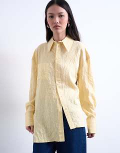 Model wearing Asymmetric placket shirt in yellow stripe