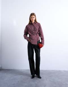 Model wearing Asymmetric placket waisted long sleeve shirt in white