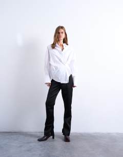 Model wearing Asymmetric placket waisted long sleeve shirt in white