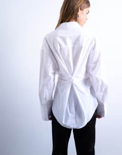 Model wearing Asymmetric placket waisted long sleeve shirt in white