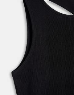Model wearing Asymmetric racer back vest in black