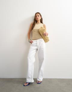 Model wearing Asymmetric racer back vest in tan