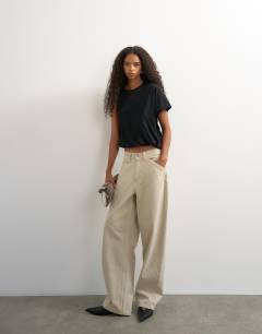 Model wearing Asymmetric ruched back tee in black