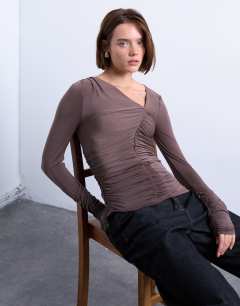Model wearing Asymmetric ruched long sleeve top in brown