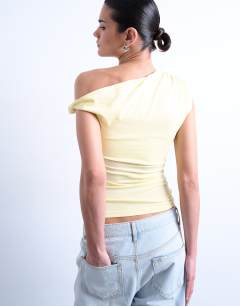 Model wearing Asymmetric ruched shoulder top in buttermilk