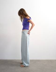 Model wearing Asymmetric ruched shoulder top in purple