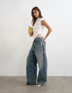 Model wearing Asymmetric ruched side top in white