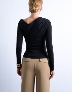 Model wearing Asymmetric slash neck long sleeve top in black
