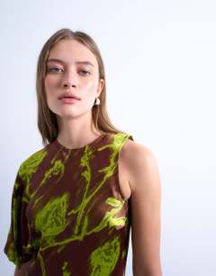 Model wearing Asymmetric sleeve full hem occasion midi dress in green blurred rose