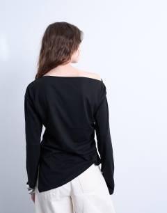 Model wearing Asymmetrical jersey slash neck long sleeve top in black