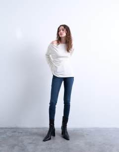 Model wearing Asymmetrical slash neck long sleeve top in off white