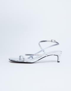 Model wearing Autumn minimal mid heel sandal in silver