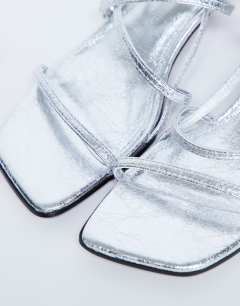 Model wearing Autumn minimal mid heel sandal in silver