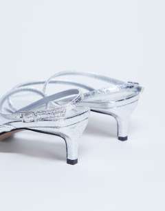 Model wearing Autumn minimal mid heel sandal in silver