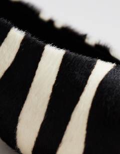 Model wearing Avril hair on real leather kitten heel mid court shoe in black and white zebra