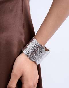 Model wearing Bala stainless steel cuff hammered bracelet in silver