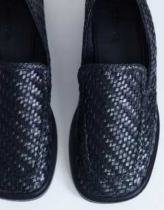 Model wearing Bali leather weave flat shoe loafer in black