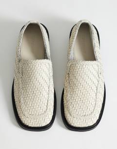 Model wearing Bali leather weave flat shoe loafer in off white 