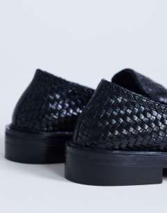 Model wearing Bali real leather weave flat shoe loafer in black