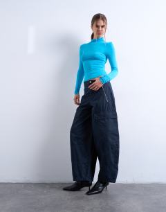 Model wearing Balloon cargo trouser with zip and pocket details in charcoal