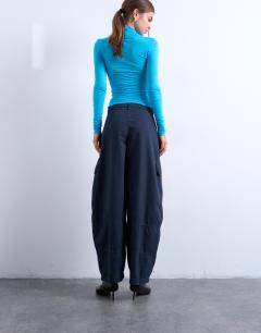 Model wearing Balloon cargo trouser with zip and pocket details in charcoal