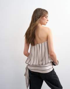 Model wearing Bandeau bubble stripe top in beige