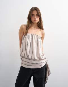 Model wearing Bandeau bubble stripe top in beige