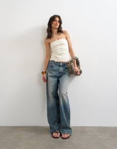 Model wearing Bandeau button detail top in ecru
