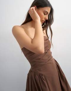 Model wearing Bandeau cinch waist structured maxi dress in chocolate