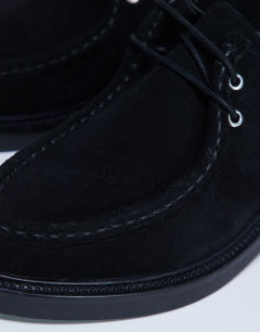 Model wearing Banks real suede leather lace up shoe in black
