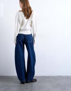 Model wearing Barge barrel high rise jean in indigo rinse
