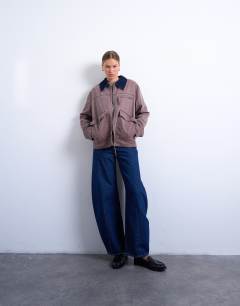 Model wearing Barn jacket with contrast collar detail in purple