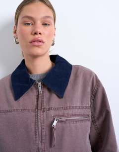 Model wearing Barn jacket with contrast collar detail in purple