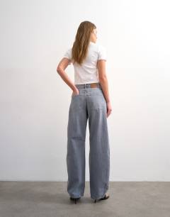 Model wearing Barrel high rise jean circular design in pretty grey