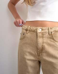 Model wearing Barrel high rise jean circular design in washed beige