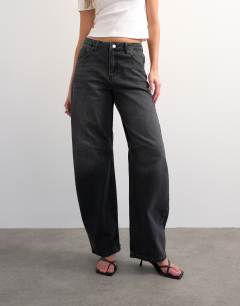 Model wearing Barrel high rise jean circular design in washed black
