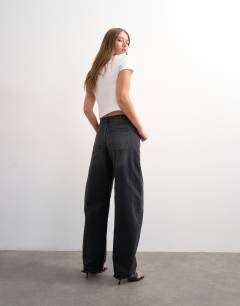 Model wearing Barrel high rise jean circular design in washed black