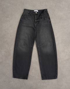 Model wearing Barrel high rise jean circular design in washed black