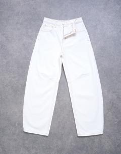Model wearing Barrel high rise jean in bone