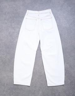 Model wearing Barrel high rise jean in bone