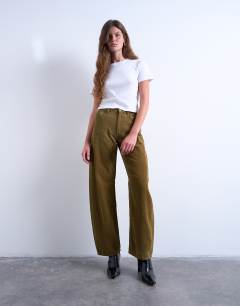 Model wearing Barrel high rise jean in honey cord